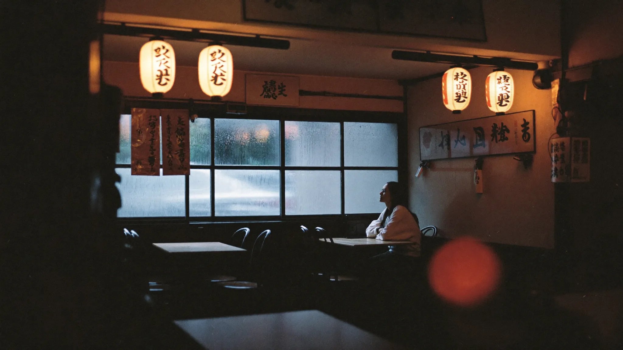 A small restaurant in Osaka on a rainy evening